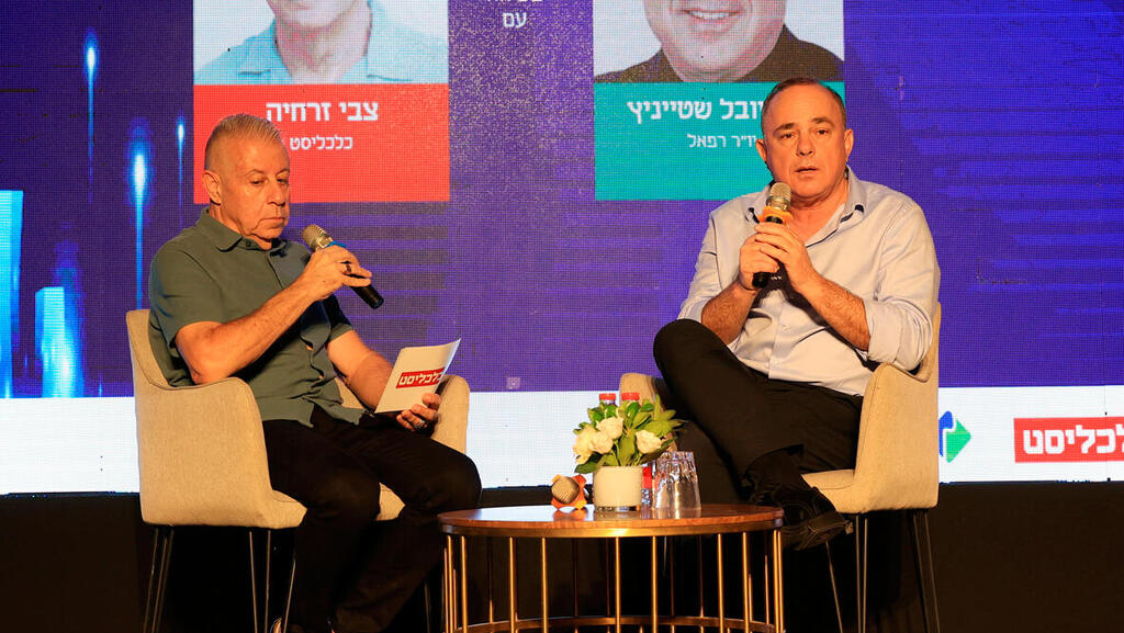 Rafael Chairman Yuval Steinitz (right) interviewed at Haifa Conference (Elad Gershgoren) כנס העתיד הכלכלי של מטרופולין חיפה - ד"ר יובל שטייניץ יו"ר רפאל בשיחה עם צביקה זרחיה וידאו