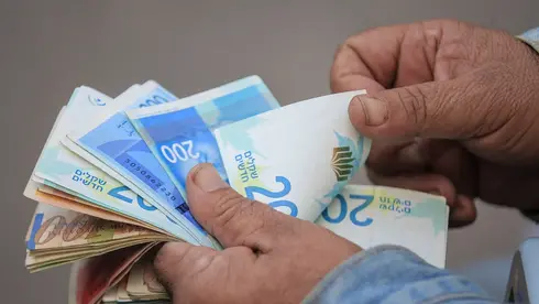 צילום: Ahmad Salem/Bloomberg השקל עשה את העבודה בשביל בנק ישראל