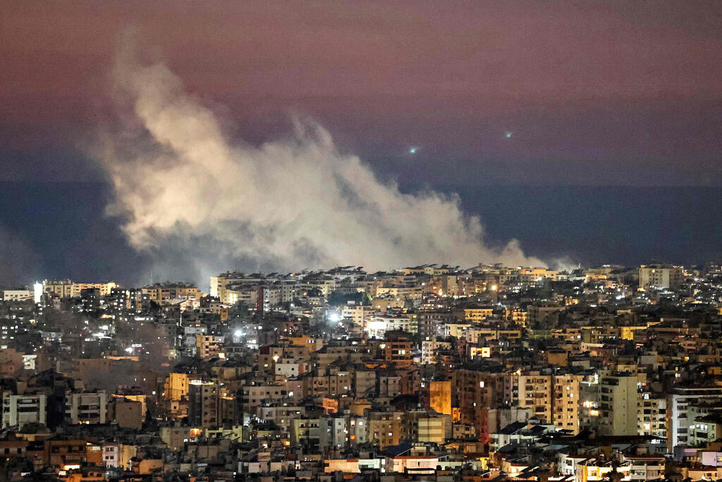 Attack in Lebanon. (Photo: IBRAHIM AMRO / AFP) תקיפה של צה"ל בדאחייה, ביירות