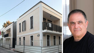 איש העסקים שלמה קרמר לצד מבנה ברחוב שבזי 7 תל אביב