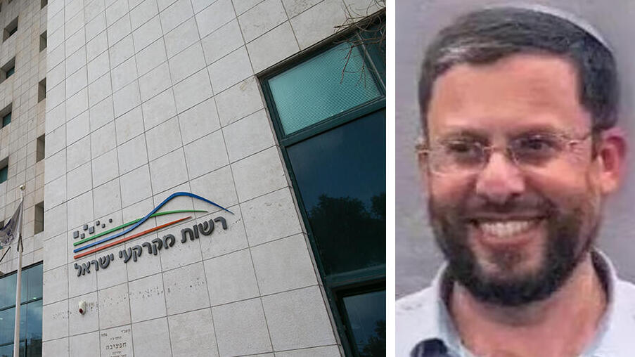 מנכ"ל מנהלת ההתיישבות יהודה אליהו לצד בניין רשות מקרקעי ישראל רמ"י