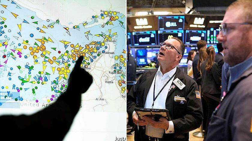 סוחרים בוול סטריט, לצד אתר המציג את תנועת האוניות במצר הורמוז