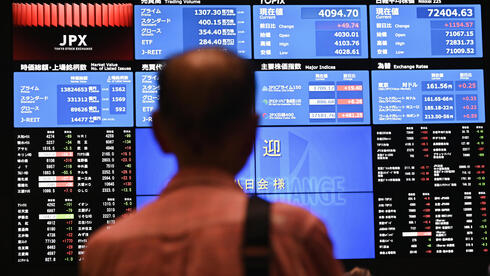 צילום: Soichiro Koriyama/Bloomberg מגמה מעורבת בבורסות באסיה; ירידות בנפט