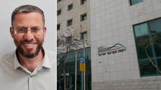 בניין רמ"י לצד מ"מ מנכ"ל רמ"י, יהודה אליהו