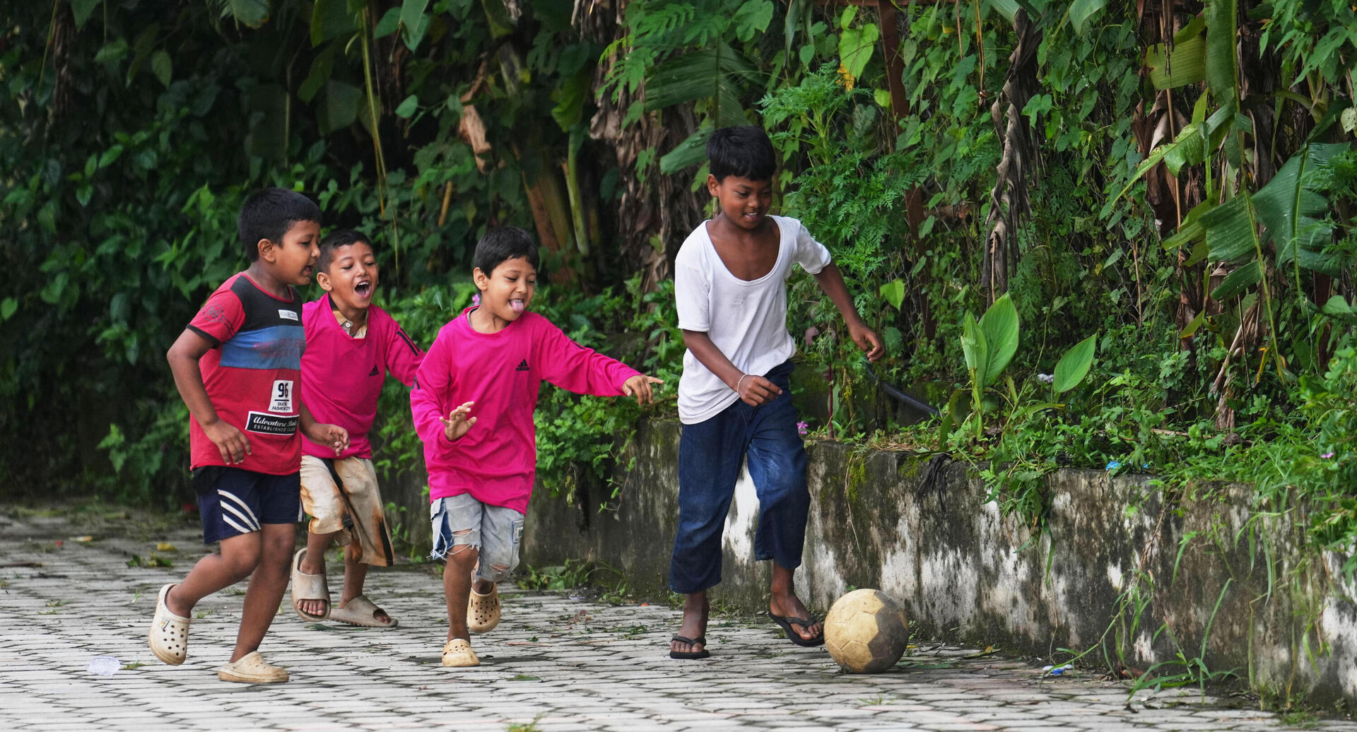 Children play football outside a school converted into a temporary shelter for displaced residents in Bidur, in Nepal's Nuwakot district, Tuesday, Sept. 1, 2026. (AP Photo/Rajesh Kumar Singh) 