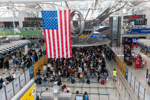 Queues at JFK Airport last month. Queues at JFK Airport last month.
