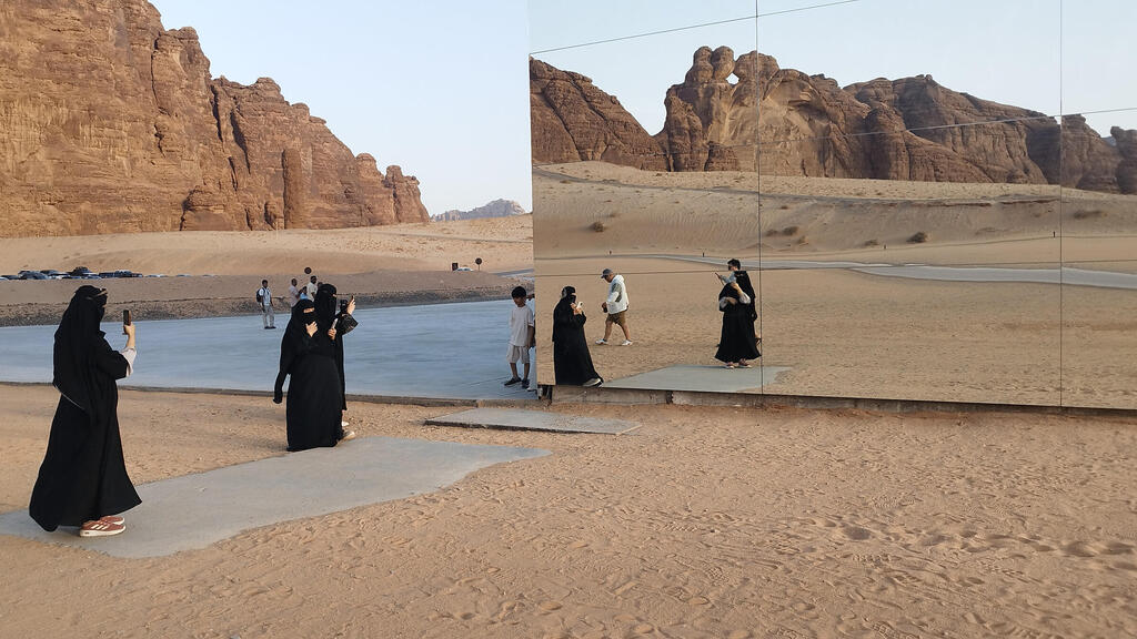 Visitors to Maraya, the innovative, mirror-clad concert hall built in the heart of the desert. (Aviad Sar-shalom) Visitors to Maraya, the innovative, mirror-clad concert hall built in the heart of the desert.