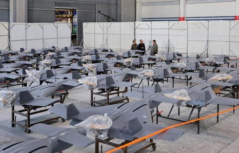 Kim Jong Un examining North Korean drones. Kim Jong Un examining North Korean drones.