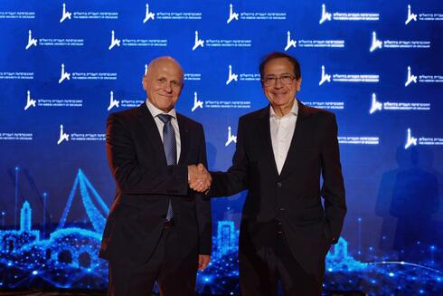 John Paulson (right) alongside Tamir Sheafer. 
