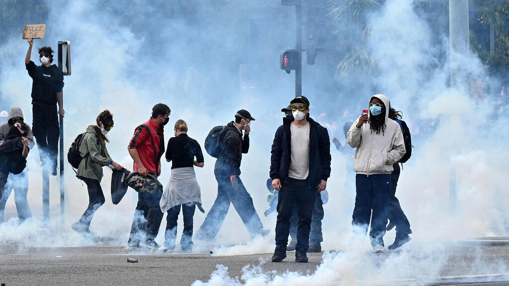 מהומות הערב בפריז (צילום: Matthieu Rondel/AFP) הפגנה הפגנות צרפת מהומות 24.10.26